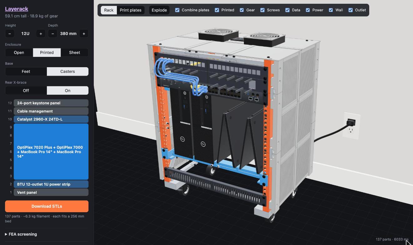 The Layerack configurator: a 12U printed rack with a switch, two small PCs and two tented MacBooks, cables routed